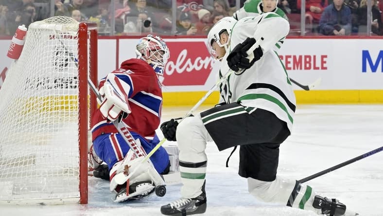 Feb 10, 2024; Montreal, Quebec, CAN; Montreal Canadiens goalie Sam Montembeault (35) makes a toe save against Dallas Stars forward Joe Pavelski (16) during the first period at the Bell Centre. Mandatory Credit: Eric Bolte-USA TODAY Sports