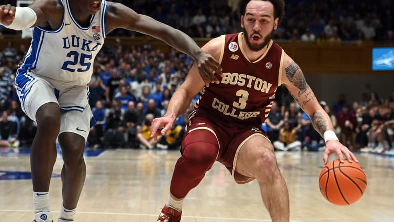 Feb 10, 2024; Durham, North Carolina, USA; Boston College Eagles guard Jaeden Zackery (3) controls the ball against Duke Blue Devils forward Mark Mitchell (25) during the first half  at Cameron Indoor Stadium. Mandatory Credit: Rob Kinnan-USA TODAY Sports