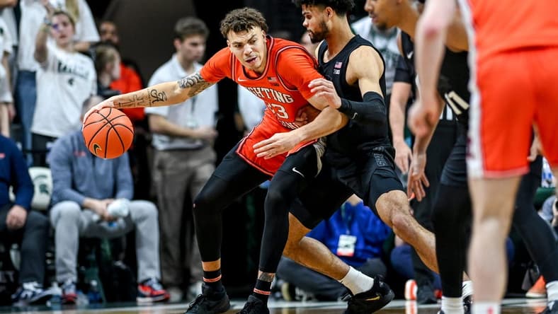 Michigan State's Malik Hall, right, guards Illinois' Coleman Hawkins during the second half on Saturday, Feb. 10, 2024, at the Breslin Center in East Lansing.