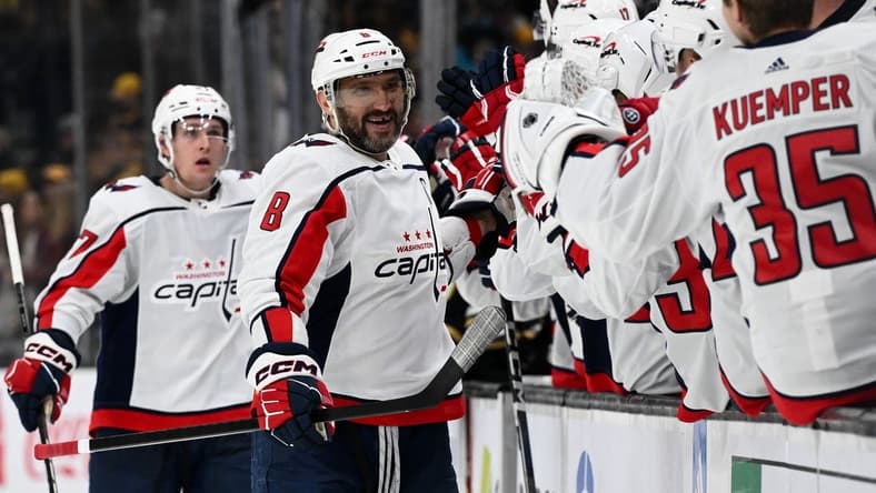 Feb 10, 2024; Boston, Massachusetts, USA; Washington Capitals left wing Alex Ovechkin (8) celebrates with his teammates after scoring a goal against the Boston Bruins during the third period at the TD Garden. Mandatory Credit: Brian Fluharty-USA TODAY Sports