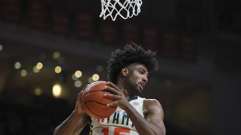 Feb 10, 2024; Coral Gables, Florida, USA; Miami Hurricanes forward Norchad Omier (15) grabs a rebound against the North Carolina Tar Heels during the first half at Watsco Center. Mandatory Credit: Sam Navarro-USA TODAY Sports