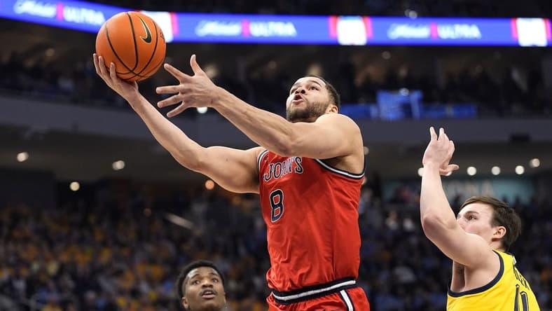 Feb 10, 2024; Milwaukee, Wisconsin, USA; St. John's Red Storm guard Chris Ledlum (8) shoots in front of Marquette Golden Eagles guard Tyler Kolek (11) during the first half at Fiserv Forum. Mandatory Credit: Jeff Hanisch-USA TODAY Sports