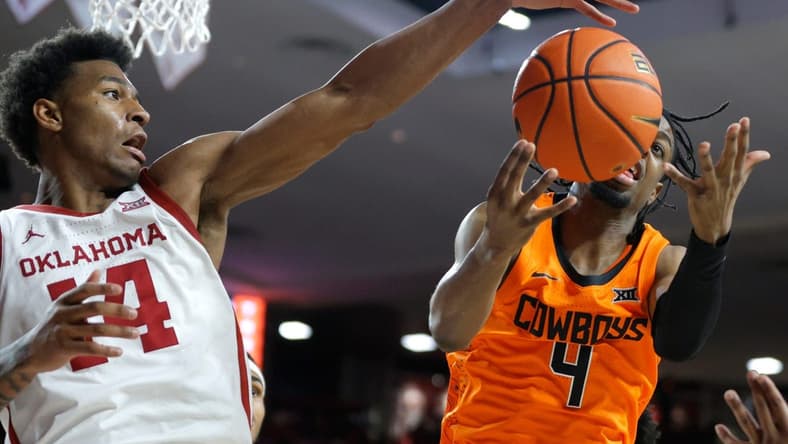 Oklahoma Sooners forward Jalon Moore (14) reaches for the ball beside Oklahoma State Cowboys guard Jarius Hicklen (4) during a Bedlam college basketball game between the University of Oklahoma Sooners (OU) and the Oklahoma State Cowboys (OSU) at Lloyd Noble Center in Norman, Okla., Saturday, Feb. 10, 2024.