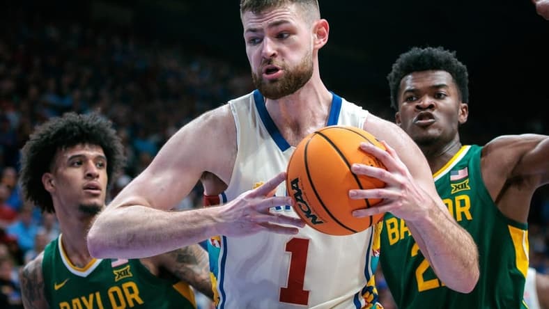 Feb 10, 2024; Lawrence, Kansas, USA; Kansas Jayhawks center Hunter Dickinson (1) protects the ball during the second half against the Baylor Bears at Allen Fieldhouse. Mandatory Credit: William Purnell-USA TODAY Sports