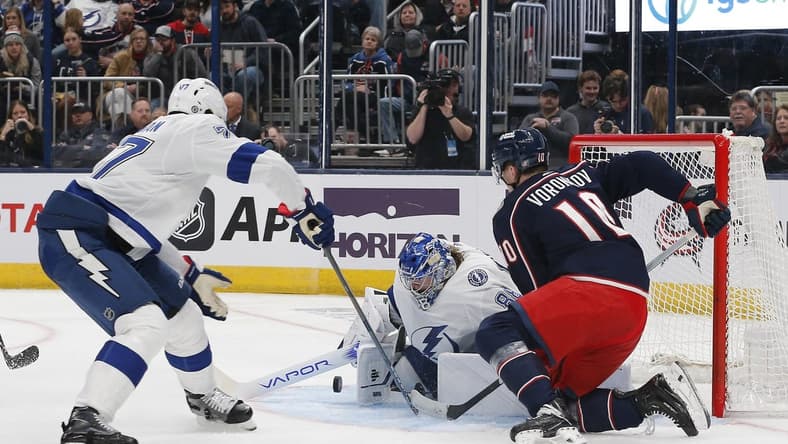 Feb 10, 2024; Columbus, Ohio, USA; Tampa Bay Lightning goalie Andrei Vasilevskiy (88) makes a save as Columbus Blue Jackets left wing Dmitri Voronkov (10) looks for a rebound during the second period at Nationwide Arena. Mandatory Credit: Russell LaBounty-USA TODAY Sports