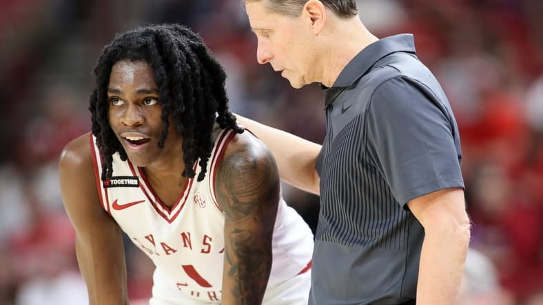 Feb 10, 2024; Fayetteville, Arkansas, USA; Arkansas Razorbacks guard Keyon Menifield Jr (1) talks to head coach Eric Musselman during the second half against the Georgia Bulldogs at Bud Walton Arena. Arkansas won 78-75. Mandatory Credit: Nelson Chenault-USA TODAY Sports
