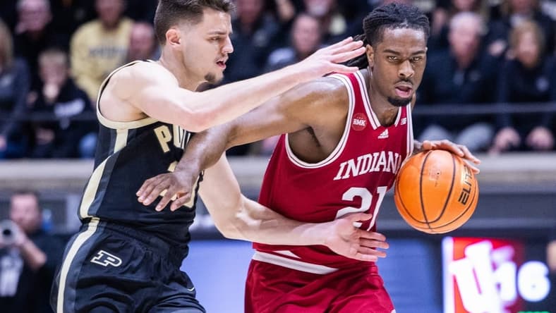 Feb 10, 2024; West Lafayette, Indiana, USA; (Editors Notes: Caption Correction) Indiana Hoosiers forward Mackenzie Mgbako (21) dribbles the ball while Purdue Boilermakers forward Camden Heide (23) defends in the first half at Mackey Arena. Mandatory Credit: Trevor Ruszkowski-USA TODAY Sports