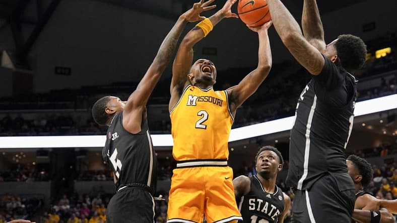 Feb 10, 2024; Columbia, Missouri, USA; Missouri Tigers guard Tamar Bates (2) shoots and is fouled by Mississippi State Bulldogs guard Shawn Jones Jr. (5) during the first half at Mizzou Arena. Mandatory Credit: Denny Medley-USA TODAY Sports