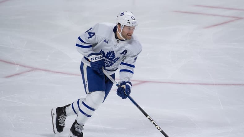 Feb 10, 2024; Ottawa, Ontario, CAN; Toronto Maple Leafs defenseman Morgan Rielly (44) skates with the puck in the third period against the Ottawa Senators at the Canadian Tire Centre. Mandatory Credit: Marc DesRosiers-USA TODAY Sports