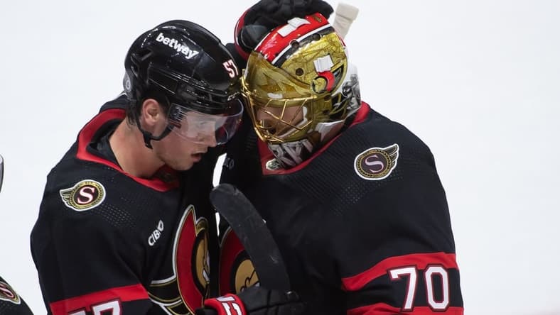 Feb 10, 2024; Ottawa, Ontario, CAN; Ottawa Senators center Shane Pinto (57) celebrates with goalie Joonas Korpisalo (70) their win against the Toronto Maple Leafs at the Canadian Tire Centre. Mandatory Credit: Marc DesRosiers-USA TODAY Sports