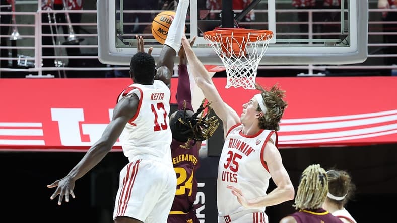 Feb 10, 2024; Salt Lake City, Utah, USA; Utah Utes center Branden Carlson (35) blocks the shot of Arizona State Sun Devils forward Bryant Selebangue (24) during the second half to become the all time Utah Utes shot block leader at Jon M. Huntsman Center. Mandatory Credit: Rob Gray-USA TODAY Sports