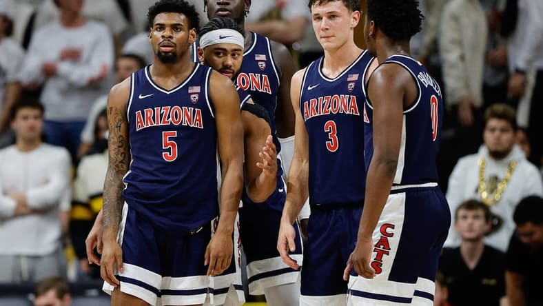 Feb 10, 2024; Boulder, Colorado, USA; Arizona Wildcats guard KJ Lewis (5) and guard Kylan Boswell (4) and center Oumar Ballo (11) and guard Pelle Larsson (3) and guard Jaden Bradley (0) in the first half against the Colorado Buffaloes at CU Events Center. Mandatory Credit: Isaiah J. Downing-USA TODAY Sports