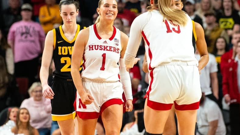 Feb 11, 2024; Lincoln, Nebraska, USA; Nebraska Cornhuskers guard Jaz Shelley (1) celebrates after making a three point shot against Iowa Hawkeyes guard Caitlin Clark (22) during the fourth quarter at Pinnacle Bank Arena. Mandatory Credit: Dylan Widger-USA TODAY Sports