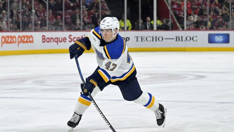 Feb 11, 2024; Montreal, Quebec, CAN; St.Louis Blues defenseman Torey Krug (47) takes a shot on net during the third period of the game against the Montreal Canadiens at the Bell Centre. Mandatory Credit: Eric Bolte-USA TODAY Sports
