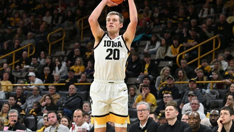 Feb 11, 2024; Iowa City, Iowa, USA; Iowa Hawkeyes forward Payton Sandfort (20) attempts a three point basket against the Minnesota Golden Gophers during the second half at Carver-Hawkeye Arena. Mandatory Credit: Jeffrey Becker-USA TODAY Sports
