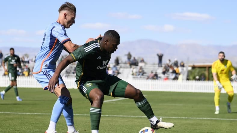 Feb 10, 2024; Indio, CA, USA; Portland Timbers defender Kamal Miller (4) moves the ball while New York City FC forward Hannes Wolf (17) defends at Empire Polo Club. Mandatory Credit: Kelvin Kuo-USA TODAY Sports