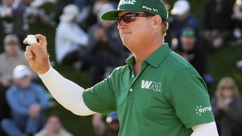Feb 11, 2024; Scottsdale, AZ, USA; Charley Hoffman finishes with in the lead on the 18th hole during the final round of the WM Phoenix Open at TPC Scottsdale. Mandatory Credit: Rob Schumacher-Arizona Republic