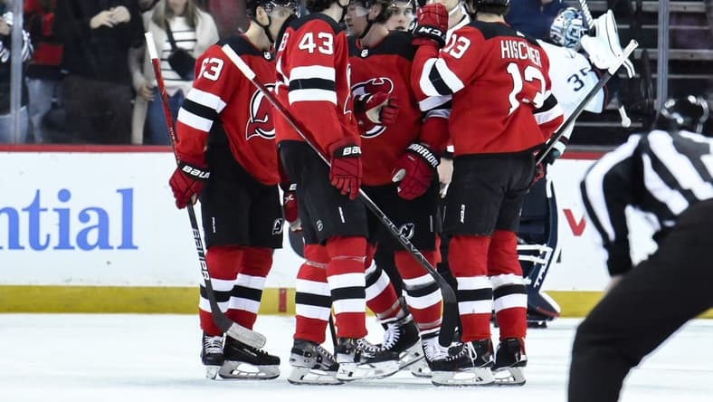 Feb 12, 2024; Newark, New Jersey, USA; New Jersey Devils right wing Tyler Toffoli (73) celebrates with teammates after scoring a goal against the Seattle Kraken during the first period at Prudential Center. Mandatory Credit: John Jones-USA TODAY Sports