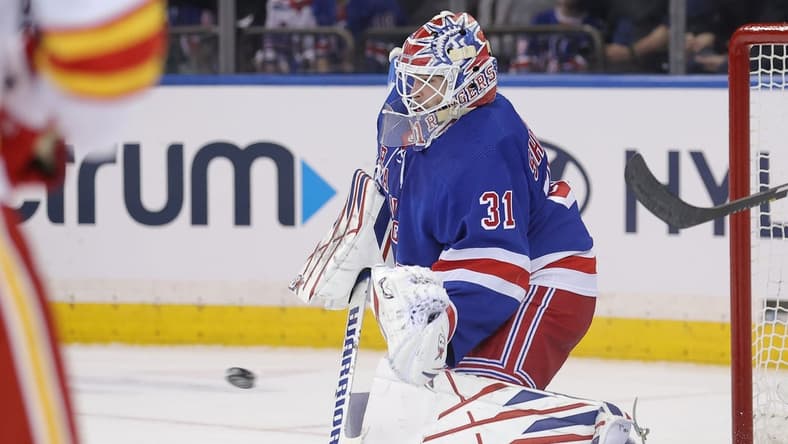 Feb 12, 2024; New York, New York, USA; New York Rangers goaltender Igor Shesterkin (31) makes a save against the Calgary Flames during the second period at Madison Square Garden. Mandatory Credit: Brad Penner-USA TODAY Sports