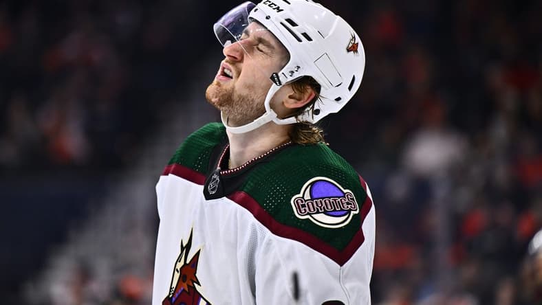 Feb 12, 2024; Philadelphia, Pennsylvania, USA; Arizona Coyotes defenseman J.J. Moser (90) reacts against the Philadelphia Flyers in the third period at Wells Fargo Center. Mandatory Credit: Kyle Ross-USA TODAY Sports