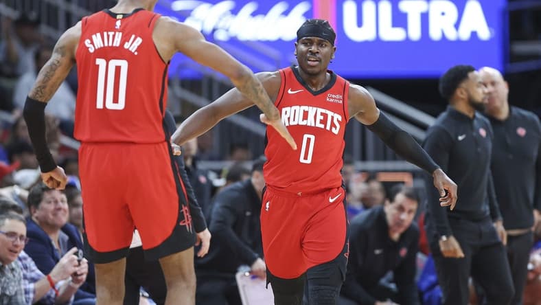 Feb 12, 2024; Houston, Texas, USA; Houston Rockets guard Aaron Holiday (0) celebrates with forward Jabari Smith Jr. (10) after a play during the fourth quarter against the New York Knicks at Toyota Center. Mandatory Credit: Troy Taormina-USA TODAY Sports