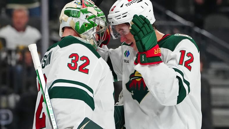 Feb 12, 2024; Las Vegas, Nevada, USA; Minnesota Wild left wing Matt Boldy (12) congratulates Minnesota Wild goaltender Filip Gustavsson (32) after the Wild defeated the Vegas Golden Knights 5-3 at T-Mobile Arena. Mandatory Credit: Stephen R. Sylvanie-USA TODAY Sports