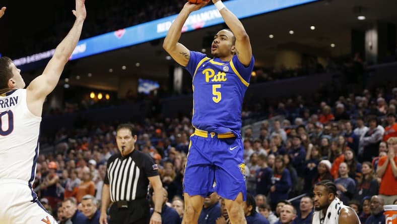 Feb 13, 2024; Charlottesville, Virginia, USA; Pittsburgh Panthers guard Ishmael Leggett (5) shoots the ball over Virginia Cavaliers guard Taine Murray (10) during the first half at John Paul Jones Arena. Mandatory Credit: Amber Searls-USA TODAY Sports