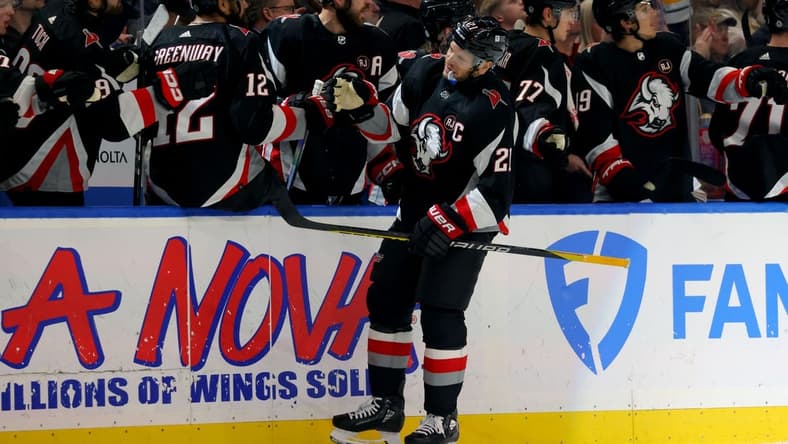 Feb 13, 2024; Buffalo, New York, USA; Buffalo Sabres right wing Kyle Okposo (21) celebrates his goal with teammates during the first period against the Los Angeles Kings at KeyBank Center. Mandatory Credit: Timothy T. Ludwig-USA TODAY Sports