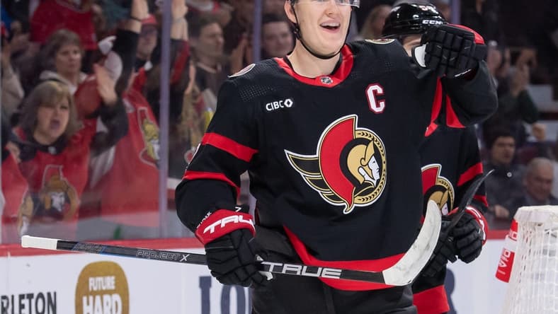Feb 13, 2024; Ottawa, Ontario, CAN; Ottawa Senators left wing Brady Tkachuk (7) celebrates his goal scored in the first period against the Columbus Blue Jackets at the Canadian Tire Centre. Mandatory Credit: Marc DesRosiers-USA TODAY Sports