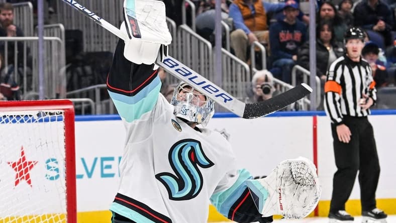 Feb 13, 2024; Elmont, New York, USA; Seattle Kraken goaltender Philipp Grubauer (31) makes a blocker save against the New York Islanders during the second period at UBS Arena. Mandatory Credit: Dennis Schneidler-USA TODAY Sports