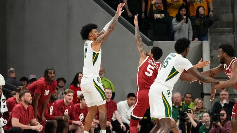 Feb 13, 2024; Waco, Texas, USA; Baylor Bears forward Jalen Bridges (11) scores a three point basket against Oklahoma Sooners guard Rivaldo Soares (5) during the first half at Paul and Alejandra Foster Pavilion. Mandatory Credit: Chris Jones-USA TODAY Sports