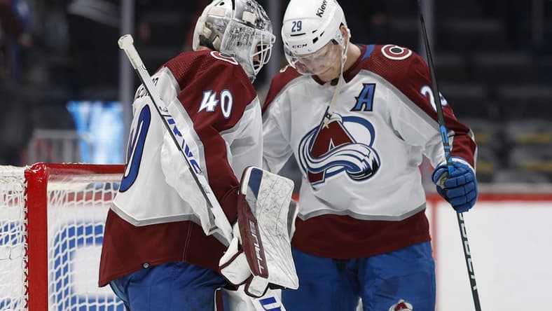 Feb 13, 2024; Washington, District of Columbia, USA; Colorado Avalanche goaltender Alexandar Georgiev (40) celebrates wth Avalanche center Nathan MacKinnon (29) after their game against the Washington Capitals at Capital One Arena. Mandatory Credit: Geoff Burke-USA TODAY Sports