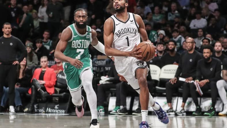 Feb 13, 2024; Brooklyn, New York, USA; Brooklyn Nets forward Mikal Bridges (1) drives past Boston Celtics guard Jaylen Brown (7) in the third quarter at Barclays Center. Mandatory Credit: Wendell Cruz-USA TODAY Sports