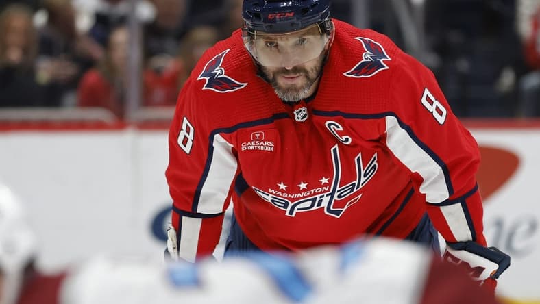 Feb 13, 2024; Washington, District of Columbia, USA; Washington Capitals left wing Alex Ovechkin (8) lines up for a face-off against the Colorado Avalanche in the third period at Capital One Arena. Mandatory Credit: Geoff Burke-USA TODAY Sports