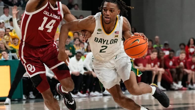 Feb 13, 2024; Waco, Texas, USA;  Baylor Bears guard Jayden Nunn (2) drives to the basket against Oklahoma Sooners forward Jalon Moore (14) during the second half at Paul and Alejandra Foster Pavilion. Mandatory Credit: Chris Jones-USA TODAY Sports