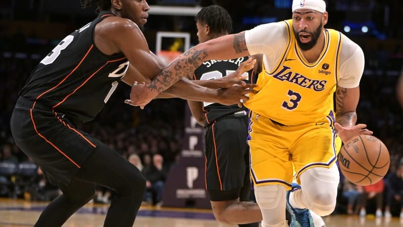 Feb 13, 2024; Los Angeles, California, USA; Los Angeles Lakers forward Anthony Davis (3) is defended by Detroit Pistons center James Wiseman (13) in the first half at Crypto.com Arena. Mandatory Credit: Jayne Kamin-Oncea-USA TODAY Sports