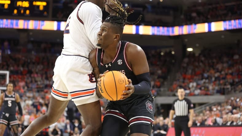 Feb 14, 2024; Auburn, Alabama, USA; South Carolina Gamecocks forward B.J. Mack (2) is fouled by Auburn Tigers forward Jaylin Williams (2) during the first half at Neville Arena. Mandatory Credit: John Reed-USA TODAY Sports