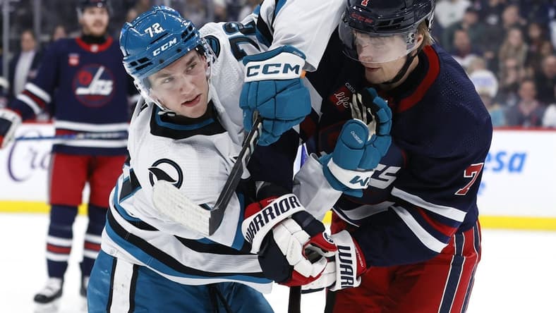 Feb 14, 2024; Winnipeg, Manitoba, CAN; San Jose Sharks left wing William Eklund (72) and Winnipeg Jets center Vladislav Namestnikov (7) tangle up in the second period at Canada Life Centre. Mandatory Credit: James Carey Lauder-USA TODAY Sports