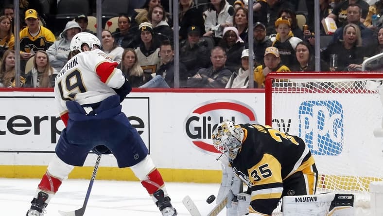 Feb 14, 2024; Pittsburgh, Pennsylvania, USA; Pittsburgh Penguins goaltender Tristan Jarry (35) makes a save against Florida Panthers left wing Matthew Tkachuk (19) during the second period at PPG Paints Arena. Mandatory Credit: Charles LeClaire-USA TODAY Sports