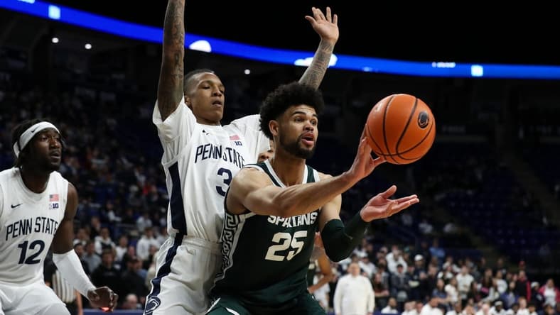 Feb 14, 2024; University Park, Pennsylvania, USA; Michigan State Spartans forward Malik Hall (25) passes the ball as Penn State Nittany Lions guard Nick Kern Jr (3) defends during the second half at Bryce Jordan Center. Michigan State defeated Penn State 80-72. Mandatory Credit: Matthew O'Haren-USA TODAY Sports