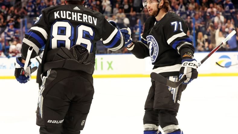 Feb 15, 2024; Tampa, Florida, USA; Tampa Bay Lightning right wing Nikita Kucherov (86) is Colorado Avalanche by Tampa Bay Lightning center Anthony Cirelli (71) after he scored a goal against the Colorado Avalanche during the first period at Amalie Arena. Mandatory Credit: Kim Klement Neitzel-USA TODAY Sports