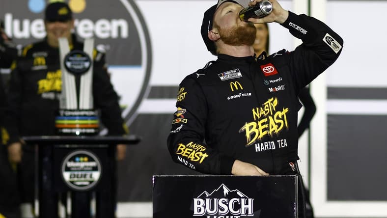 Feb 15, 2024; Daytona Beach, Florida, USA; NASCAR Cup Series driver Tyler Reddick (45) reacts in victory lane after winning the Bluegreen Vacations Duel 1 at Daytona International Speedway. Mandatory Credit: Peter Casey-USA TODAY Sports