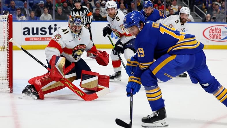 Feb 15, 2024; Buffalo, New York, USA;  Buffalo Sabres center Peyton Krebs (19) looks to take a shot on Florida Panthers goaltender Anthony Stolarz (41) during the second period at KeyBank Center. Mandatory Credit: Timothy T. Ludwig-USA TODAY Sports