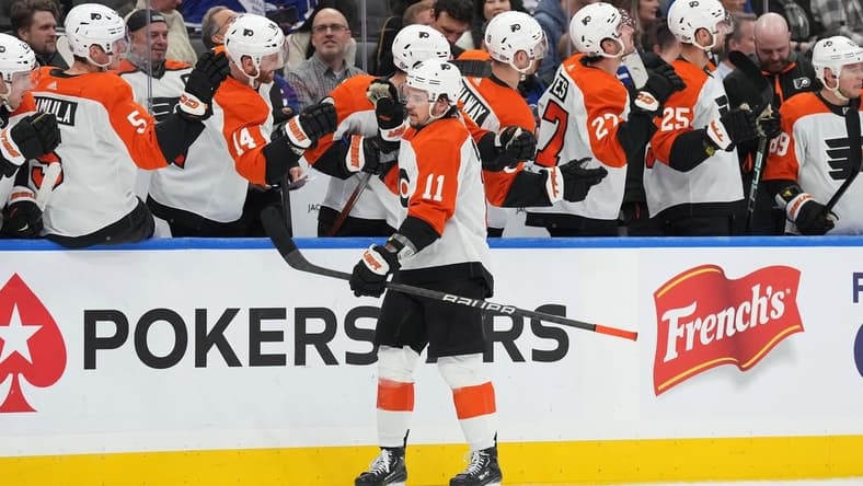 Feb 15, 2024; Toronto, Ontario, CAN; Philadelphia Flyers right wing Travis Konecny (11) celebrates with teammates after scoring a goal against the Toronto Maple Leafs during the third period at Scotiabank Arena. Mandatory Credit: Nick Turchiaro-USA TODAY Sports