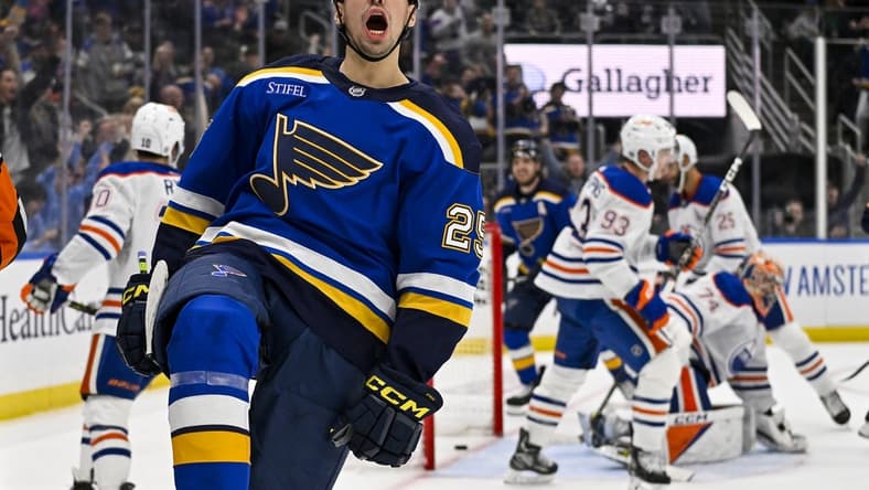 Feb 15, 2024; St. Louis, Missouri, USA; St. Louis Blues center Jordan Kyrou (25) reacts after scoring against Edmonton Oilers goaltender Stuart Skinner (74) during the second period at Enterprise Center. Mandatory Credit: Jeff Curry-USA TODAY Sports