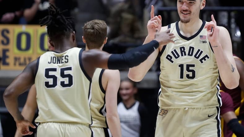 Purdue Boilermakers guard Lance Jones (55) and Purdue Boilermakers center Zach Edey (15) celebrate during the NCAA men   s basketball game against the Minnesota Golden Gophers, Thursday, Feb. 15, 2024, at Mackey Arena in West Lafayette, Ind.