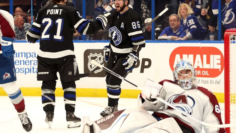 Feb 15, 2024; Tampa, Florida, USA; Tampa Bay Lightning right wing Nikita Kucherov (86) celebrates with Tampa Bay Lightning center Brayden Point (21) after he scored a goal on Colorado Avalanche goaltender Justus Annunen (60) during the third period at Amalie Arena. Mandatory Credit: Kim Klement Neitzel-USA TODAY Sports