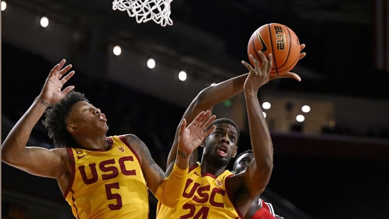 Feb 15, 2024; Los Angeles, California, USA; Southern California Trojans forward Joshua Morgan (24) gets a rebound with guard Boogie Ellis (5) against Utah Utes center Keba Keita (13) during the first half at Galen Center. Mandatory Credit: Alex Gallardo-USA TODAY Sports