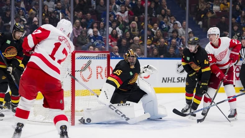 Feb 15, 2024; Vancouver, British Columbia, CAN; Vancouver Canucks goalie Thatcher Demko (35) makes a save on Detroit Red Wings forward Daniel Sprong (17) in the second period at Rogers Arena. Mandatory Credit: Bob Frid-USA TODAY Sports