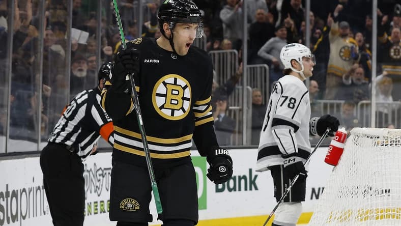 Feb 17, 2024; Boston, Massachusetts, USA; Boston Bruins left wing James van Riemsdyk (21) celebrates the first of his two goals during the first period as Los Angeles Kings right wing Alex Laferriere (78) skates away at TD Garden. Mandatory Credit: Winslow Townson-USA TODAY Sports